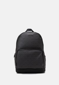 Black backpack with a textured surface, featuring a monogram pattern, front zip pocket, and a top handle for carrying.