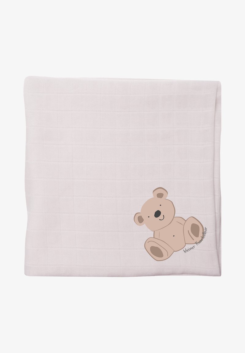 Soft, light pink blanket with a textured grid pattern. Features a brown cartoon bear sitting on the edge, with a simple, joyful expression.