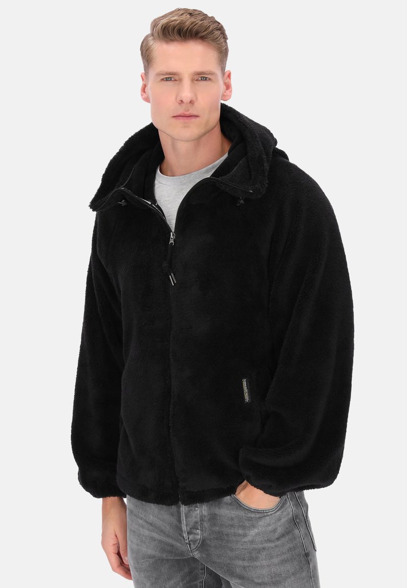 Czarna, miękka kurtka z polaru z kapturem, zamkiem błyskawicznym i przednią kieszenią. Charakteryzuje się luźnym krojem i teksturowaną tkaniną.