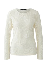 Long-sleeve top in cream lace featuring floral patterns, a round neckline, and a textured surface with subtle transparency.