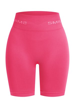 Roze hoge fietsbroek met een glad, rekbaar textuur. Heeft een zachte tailleband met "SMILE" in het wit gedrukt.