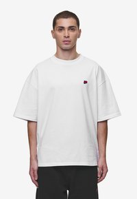 Pegador - LEONO BOXY TEE UNISEX - Lihtne T-särk - white Väikepilt 1