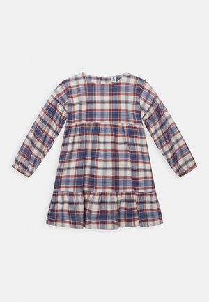 Šaty s dlouhým rukávem v károvaném vzoru s červenou, modrou a krémovou barvou. Sukně s patry, kulatým výstřihem a elastickými rukávy.