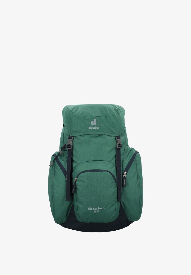 Rucsac din material verde, cu un vârf rotunjit, multiple buzunare cu fermoar, curele ajustabile și un logo în partea din față. Baza este de culoare neagră.