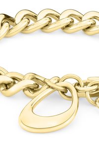 Gouden metalen kettingarmband met in elkaar grijpende schakels en een bijzondere ovale sluiting. Gladde, gepolijste afwerking met een lichte glans.