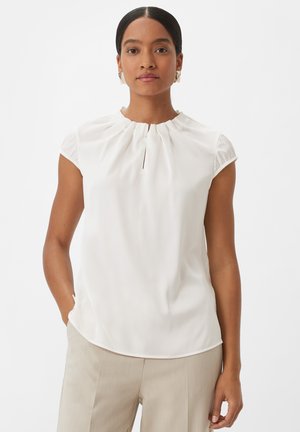 White, short-sleeve blouse with a round neckline and pleated detailing at the collar, made from smooth fabric, featuring a slight sheen.