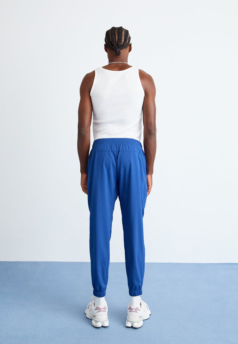 Pantalon De Survêtement VINCE Bleu Marine à Rayures Blanches - Taille S - Neuf Étiqueté