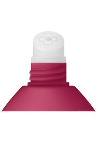 Close-up of a red squeeze bottle neck and white cap with raised cross-shaped dispenser opening.