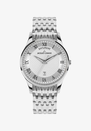 Reloj de acero inoxidable plateado con esfera blanca texturizada, números romanos, indicador de fecha y correa de eslabones. Incluye un indicador de día.