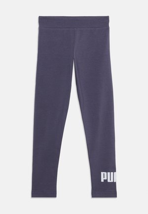 Leggings bleu foncé slim fit avec taille élastique et logo blanc "PUMA" sur le bas de la jambe gauche sur fond uni.