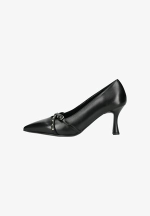 Black leather high-heeled shoe with a pointed toe, featuring a strap with metallic studs and a narrow stiletto heel. Smooth texture.