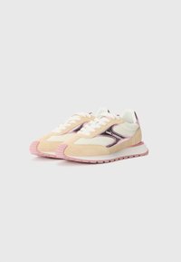 Beige and pink sneakers with mesh and suede materials, featuring a padded collar, white laces, and a pink rubber sole.