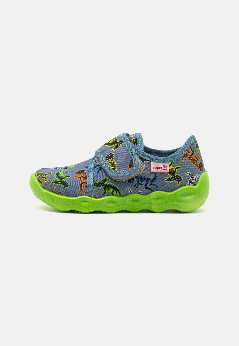 Children's shoe with a blue fabric upper featuring colorful dinosaur patterns, velcro strap, and a green rubber sole with a wavy design.