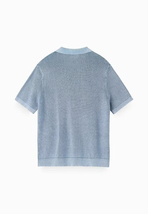 Light blue short-sleeve knit polo shirt with a ribbed texture, collar, and cuffs, shown from the back on a white background.