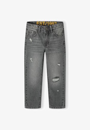 Pelēki denim džinsi ar taisnu kāju dizainu, kas satur nodilušas vagas un dzelteno "EST/1997" birku uz jostas.