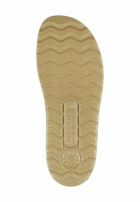 Gummisohle mit gewelltem Muster, beiger Farbe, strukturierten Oberfläche und einem geprägten Logoetikett, das die Größe 37 anzeigt.