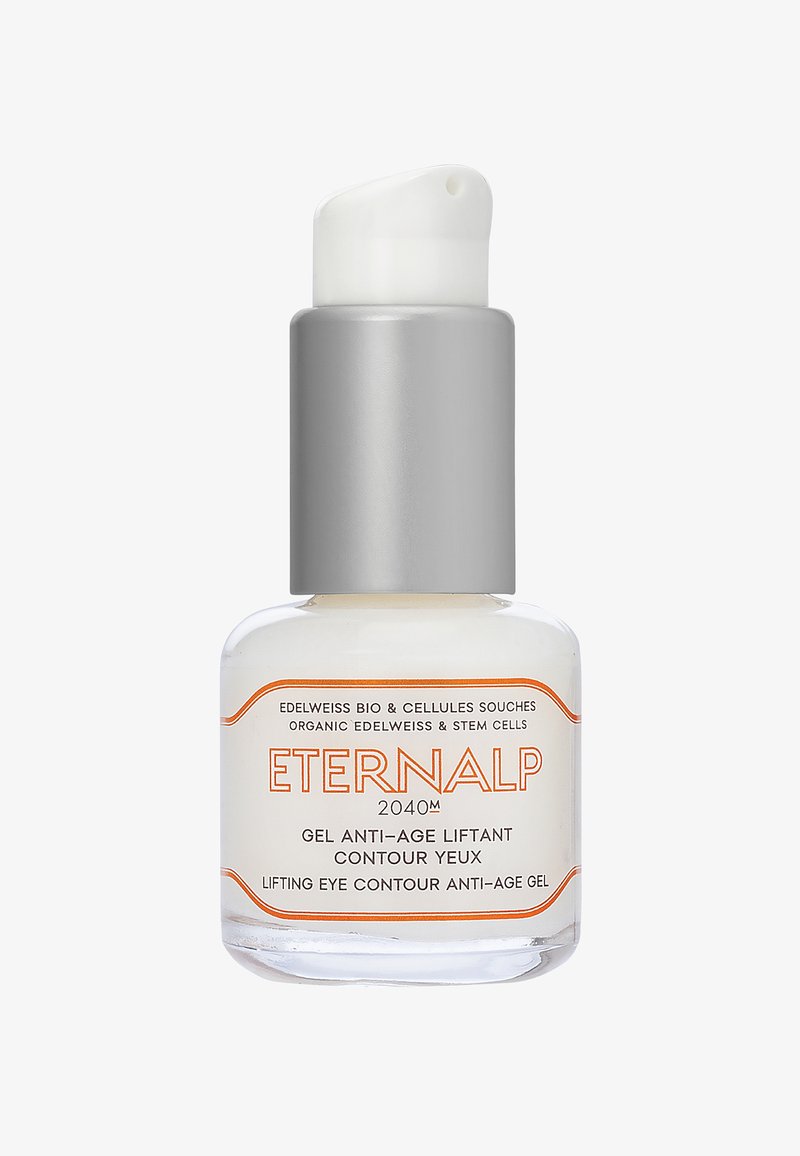 Bouteille en verre transparent avec un bouchon-pompe en métal argenté. L'étiquette présente un texte orange avec le nom et la description du produit. Contient un gel crème pâle.