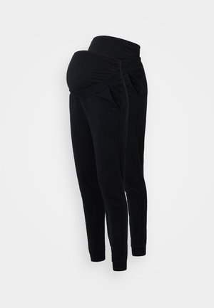 Zwarte zwangerschapsjoggingbroek met een omklapbare tailleband, zijzakken en een taps toelopend ontwerp. Gemaakt van zachte, rekbare stof voor comfort.