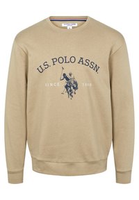 Beige sweatshirt med långa ärmar, ribbade muddar och fåll, med en marinblå logotyp och texten "U.S. POLO ASSN. SINCE 1890."