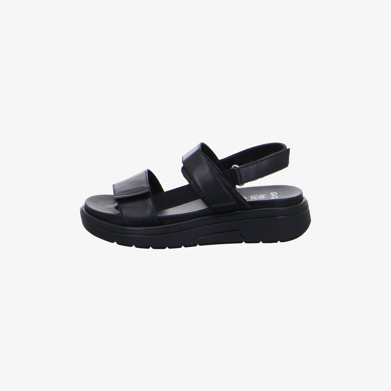 Black open-toe sandal with thick sole, adjustable ankle strap, and two wide front straps made of leather or faux leather.