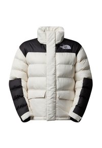 Puffjakke i creme og sort, med høj krave, quiltet tekstur og to forlommer; har "The North Face"-logoet på brystet.