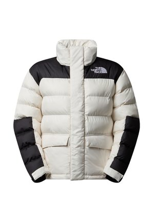 Giacca a vento in crema e nero, con colletto alto, texture trapuntata e due tasche frontali; presenta il logo "The North Face" sul petto.