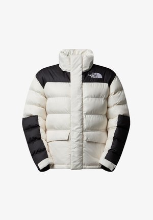 Doudoune en crème et noir, avec un col haut, un aspect matelassé et deux poches avant ; arbore le logo "The North Face" sur la poitrine.