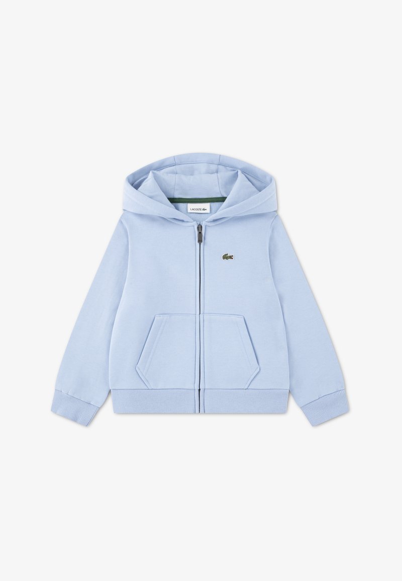 Svetlo modra jopa z zadrgo iz mehkega bombaža z žepom kenguru, rebrastimi manšetami in spodnjim robom ter vezenim logotipom na prsih.