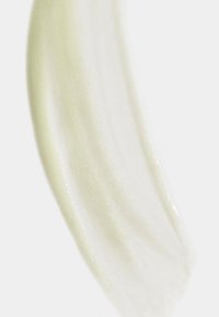 Swatch of pale green cream with a smooth, glossy texture and subtle shimmer, displayed on a light background.