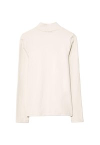 Krémová dlouhá turtleneck košile s dlouhým rukávem, jednoduchý design, zobrazená zezadu na bílém pozadí.