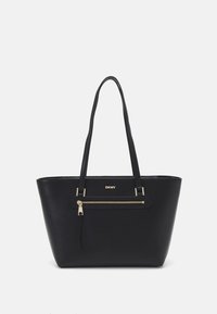 Black leather tote bag with a textured finish, two long handles, and a front zipped pocket. Gold-tone hardware adds contrast.