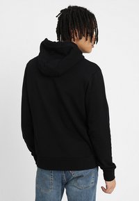 Calvin Klein LOGO HOODIE - Sweatshirt - perfect black