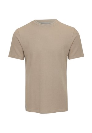 Camiseta de manga corta beige hecha de tejido texturizado, con cuello redondo y un diseño sutil. El dobladillo es recto y sin adornos.