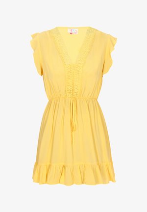 Sárga, rövid ujjú ruha V-nyakkivágással, csipkés díszítéssel a nyakkivágás mentén, gumis derekú és fodros szegéllyel. Könnyű anyagból készült.
