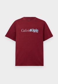 Burgundy short-sleeve T-shirt with "Calvin Klein New York" logo in white and light blue across the chest.