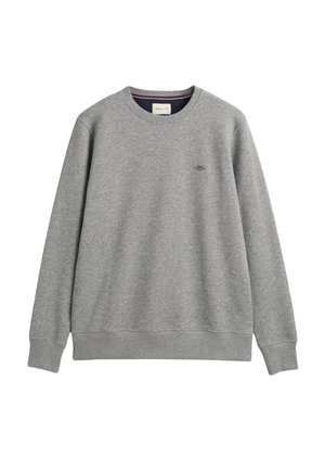 Sudadera gris hecha de una tela suave, con cuello redondo, mangas largas y un pequeño logo bordado en el lado izquierdo del pecho.