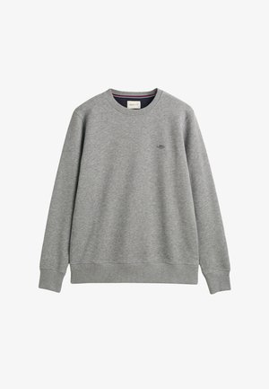 Sudadera gris hecha de una tela suave, con cuello redondo, mangas largas y un pequeño logo bordado en el lado izquierdo del pecho.