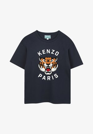 T-shirt en coton bleu marine avec un grand graphisme de tigre multicolore et le texte "KENZO PARIS" en blanc. Manches courtes et col ras du cou.