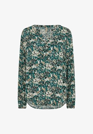 Téglakék hosszúujjú blúz virágmintával. V nyakú és ívelt alsó szegéllyel rendelkezik. Könnyű anyagból készült, kellemes tapintású.