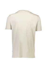 Camiseta de manga corta y cuello redondo en crema claro, hecha de algodón suave. Textura lisa con diseño simple, sin patrones ni adornos.