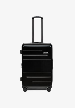 Valise rigide noire avec poignée télescopique et quatre roues, de marque Lancaster, debout sur un fond blanc.