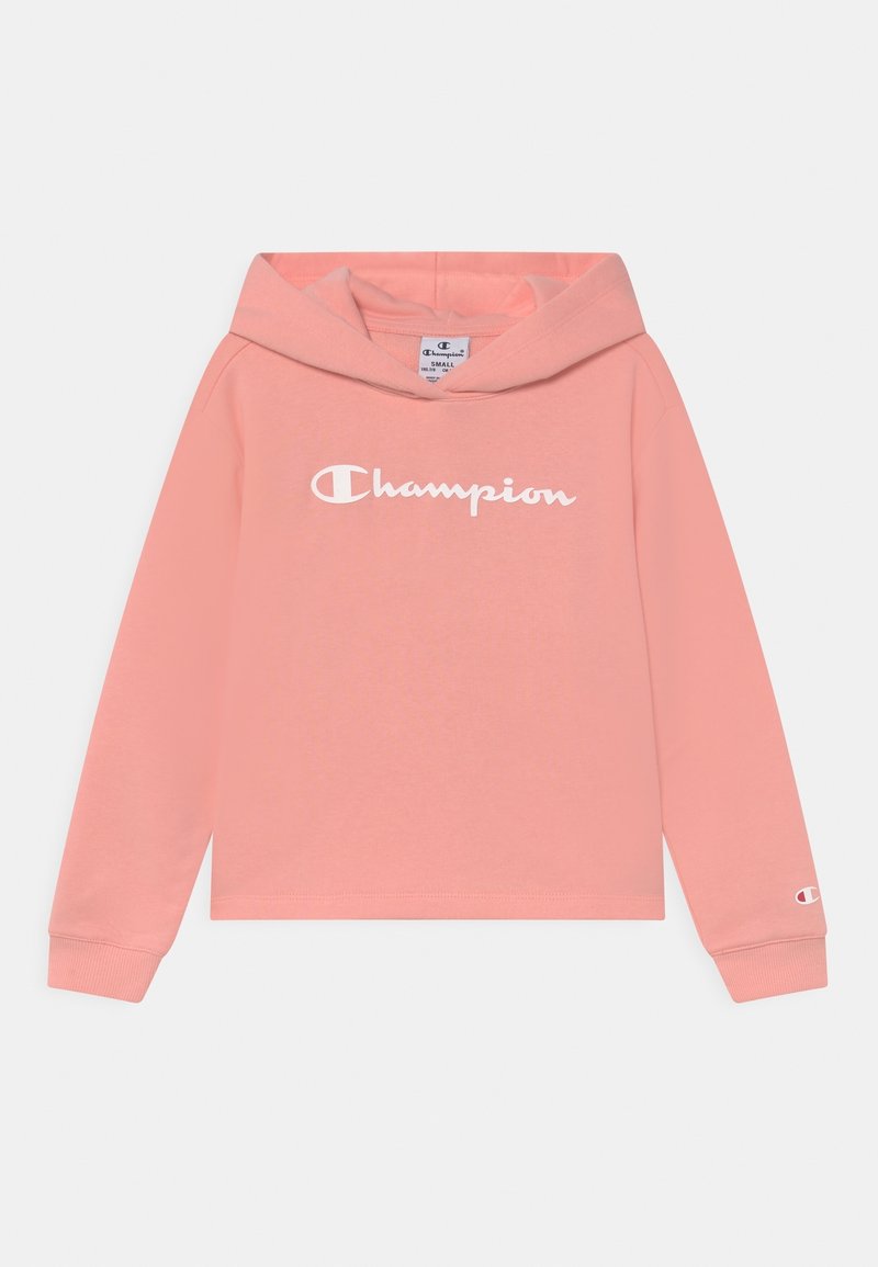 Sweat à capuche Champion rose avec manches longues, texte logo devant, petit logo sur la manche, et capuche attachée, taille petite.