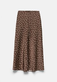 Brown midi skirt with white polka dots, flowy fabric, and a thin drawstring tie at the waist, displayed on a plain background.