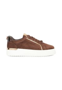 Brown suede sneaker with white rubber sole, gold accents, and a smooth black heel section. Features a front lace-up design and metallic detailing.