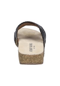 Black textured straps with a cork-colored platform sole. Features a contoured footbed and a smooth interior lining. Brand name visible.