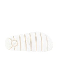 Suola di sneaker in gomma bianca con scanalature orizzontali e dettagli a motivo. Presenta un emblema circolare con grip testurizzato vicino al tallone.