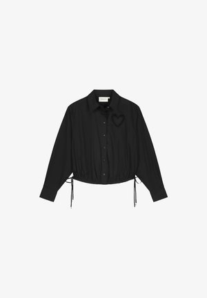Black cropped button-up shirt made of smooth fabric, featuring a drawstring hem and a heart-shaped embroidery detail on the chest.
