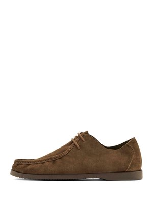 Brown suede lace-up men's casual shoe with stitched moc toe and low rubber sole, shown in side profile on white background.