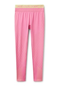 Leggings roses avec marquage jaune à la taille. Présentent des motifs de diamants et de lignes dans une teinte rose plus claire. Matériau extensible.