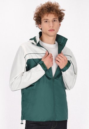 Training jacket - dunkelgrün wollweiss